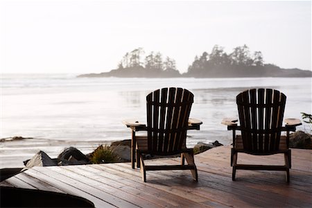 Chairs on Patio, Frank Island and Chesterman Beach, Tofino, British Columbia, Canada Stock Photo - Premium Royalty-Free, Code: 600-01275466