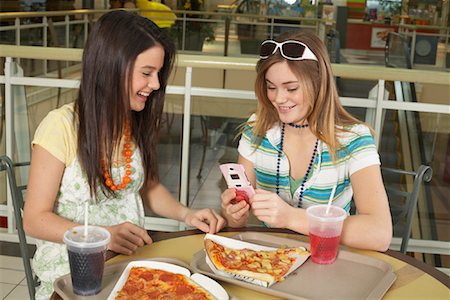 friends and eat and pizza - Teenagers at Mall Stock Photo - Premium Royalty-Free, Code: 600-01275524