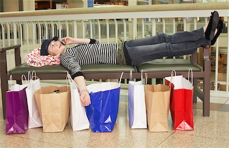 shopping spree mall - Teenager on Cell Phone at Mall Stock Photo - Premium Royalty-Free, Code: 600-01275546