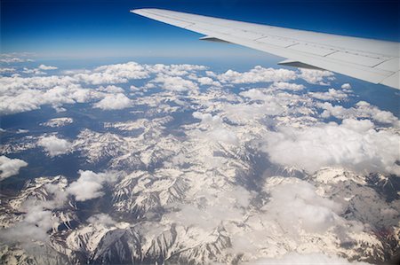 plane above cloud - View of Mountain Range From Airplane Stock Photo - Premium Royalty-Free, Code: 600-01276122