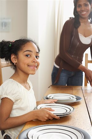 pictures of kids helping parents with dishes - Mother and Daughter Setting Table Stock Photo - Premium Royalty-Free, Code: 600-01276396