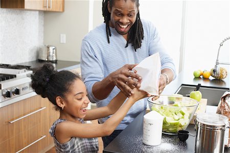 simsearch:600-00947977,k - Father and Daughter Making Applesauce in Kitchen Stock Photo - Premium Royalty-Free, Code: 600-01276409