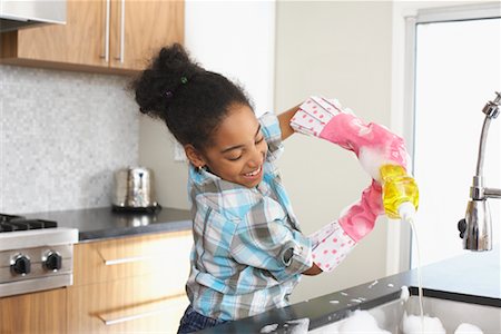 Girl Washing Dishes Stock Photo - Premium Royalty-Free, Code: 600-01276414