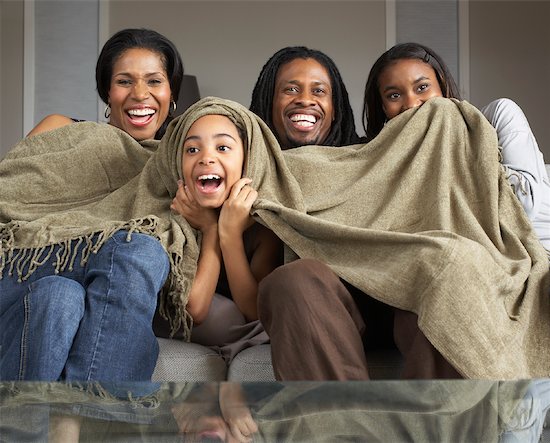 Family Watching Television Together Stock Photo - Premium Royalty-Free, Artist: Masterfile, Image code: 600-01276427