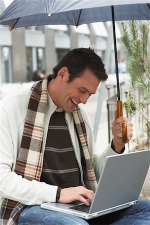 Man Using Laptop Stock Photo - Premium Royalty-Free, Code: 600-01295861