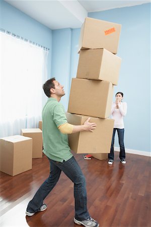 falling with box - Couple Moving into New Home Foto de stock - Sin royalties Premium, Código: 600-01345114