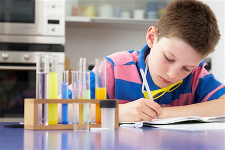 simsearch:700-03719321,k - Boy Working on Homework Stock Photo - Premium Royalty-Free, Code: 600-01374089