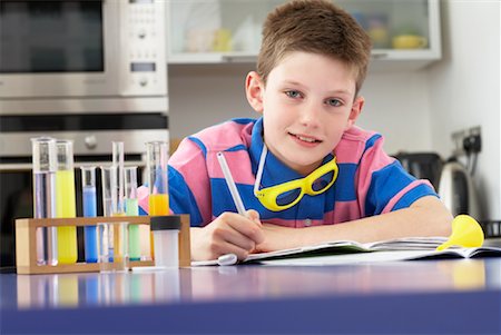 Boy Working on Homework Stock Photo - Premium Royalty-Free, Code: 600-01374090