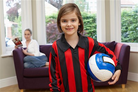 Portrait of Girl Holding Soccer Ball Stock Photo - Premium Royalty-Free, Code: 600-01374111