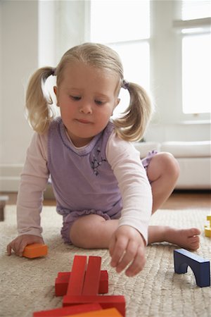 Girl Playing With Toys Stock Photo - Premium Royalty-Free, Code: 600-01374178