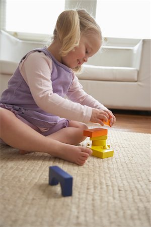 Girl Playing With Toys Stock Photo - Premium Royalty-Free, Code: 600-01374179