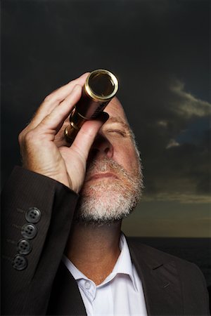 Man Looking Through Telescope Stock Photo - Premium Royalty-Free, Code: 600-01374222