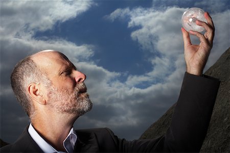 profile of old men - Businessman Looking at Sphere Stock Photo - Premium Royalty-Free, Code: 600-01374249