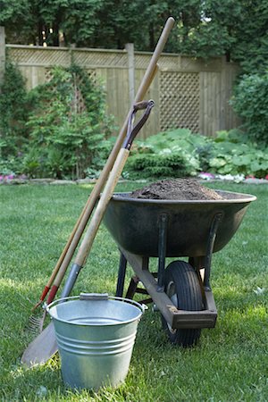 shovel in dirt - Gardening Tools in Backyard Stock Photo - Premium Royalty-Free, Code: 600-01374771