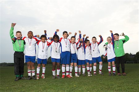 simsearch:6113-07588877,k - Portrait of Soccer Team With Gold Medals Foto de stock - Sin royalties Premium, Código: 600-01374816