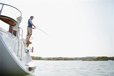 fishing boat man fishing - Man Fishing Stock Photo - Premium Royalty-Free, Code: 600-01378697