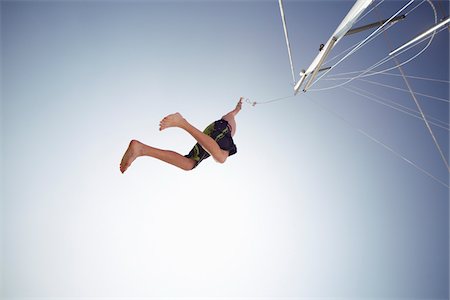 simsearch:700-02637287,k - Man Jumping off Boat Stock Photo - Premium Royalty-Free, Code: 600-01378690