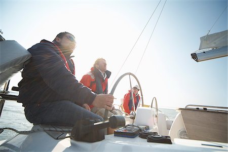 steering wheel boat - People on Yacht Stock Photo - Premium Royalty-Free, Code: 600-01378709