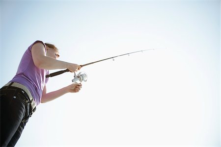 simsearch:400-06852239,k - Woman Fishing Photographie de stock - Premium Libres de Droits, Code: 600-01378701