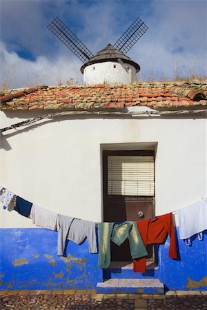 pictures of rooftop clotheslines - Clothesline and Windmill in Village, Campo de Criptana, La Mancha, Spain Stock Photo - Premium Royalty-Free, Code: 600-01378810