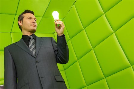 padded jacket - Man with Lightbulb in Green Padded Room Stock Photo - Premium Royalty-Free, Code: 600-01407179