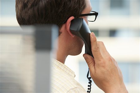 Businessman Using Telephone Stock Photo - Premium Royalty-Free, Code: 600-01407357