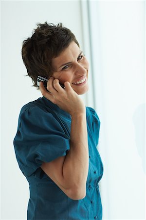 Woman Using Cellular Phone Stock Photo - Premium Royalty-Free, Code: 600-01464406