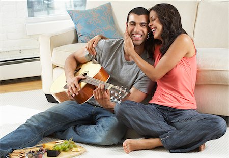 serenading - Couple Relaxing at Home Stock Photo - Premium Royalty-Free, Code: 600-01463681