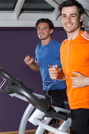 Men Working Out on Treadmills Foto de stock - Sin royalties Premium, Código: 600-01494727