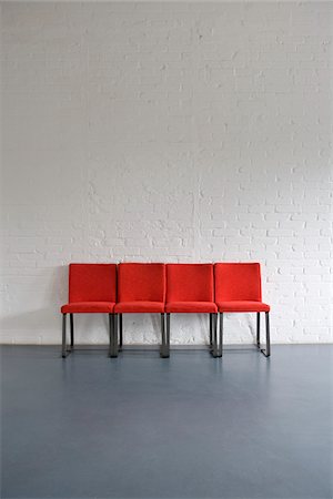 sit on chairs in a row - Red Chairs Stock Photo - Premium Royalty-Free, Code: 600-01519439