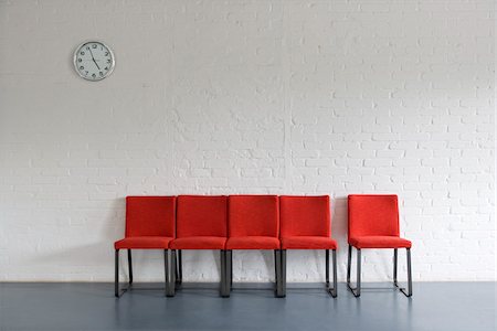 empty chairs in rows - Red Chairs and Wall Clock Stock Photo - Premium Royalty-Free, Code: 600-01519440