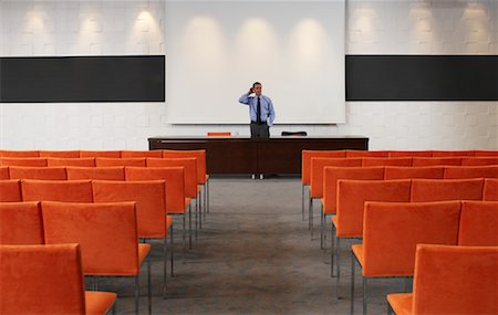 Businessman in Auditorium Stock Photo - Premium Royalty-Free, Code: 600-01540553