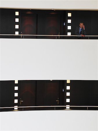 simsearch:600-01043156,k - Businessman on Balcony Fotografie stock - Premium Royalty-Free, Codice: 600-01540608