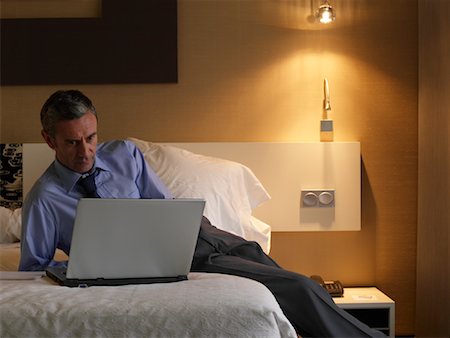 Businessman Using Laptop Computer Stock Photo - Premium Royalty-Free, Code: 600-01540614