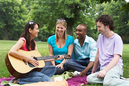 Friends Sitting Outdoors Stock Photo - Premium Royalty-Free, Code: 600-01540670