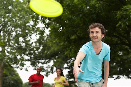 people flying disc - People Playing Frisbee Stock Photo - Premium Royalty-Free, Code: 600-01540687