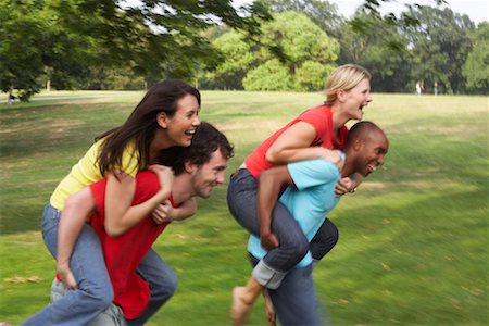 excited african american with friends - Friends Playing Outdoors Stock Photo - Premium Royalty-Free, Code: 600-01540721