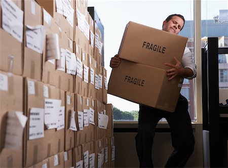 Man Carrying Boxes Foto de stock - Sin royalties Premium, Código: 600-01540763