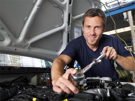 smiling blue collar guy - Man Working on Car Stock Photo - Premium Royalty-Free, Code: 600-01575542