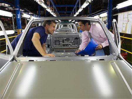 Men in Car Factory Foto de stock - Sin royalties Premium, Código: 600-01575574