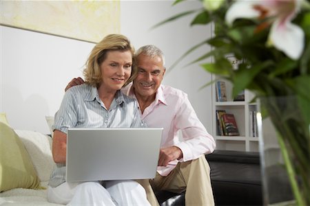 Couple Using Laptop Stock Photo - Premium Royalty-Free, Code: 600-01575632