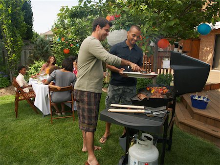 friends cooking together - People at Picnic Stock Photo - Premium Royalty-Free, Code: 600-01571865