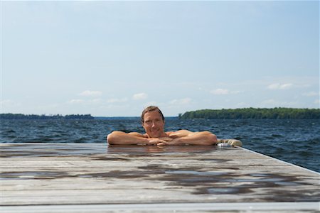 simsearch:600-01585698,k - Portrait of Man Leaning on Dock Stock Photo - Premium Royalty-Free, Code: 600-01585697