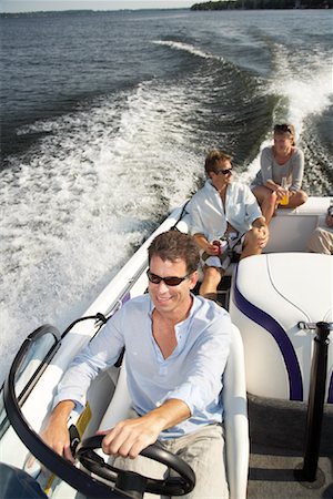 driving boat - Friends on Boat Stock Photo - Premium Royalty-Free, Code: 600-01585707