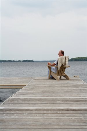 Man Relaxing on Dock Stock Photo - Premium Royalty-Free, Code: 600-01585896
