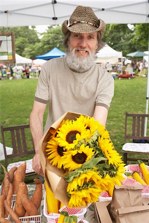 simsearch:6109-08204305,k - Man Offering Flowers at Farmers Market Stock Photo - Premium Royalty-Free, Code: 600-01586369