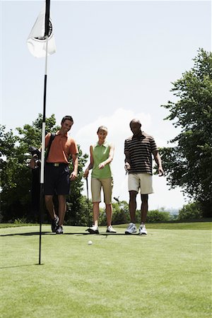 simsearch:600-02264571,k - Golfeurs marchant sur le Putting Green Photographie de stock - Premium Libres de Droits, Code: 600-01581846