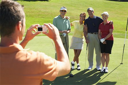 simsearch:693-06668077,k - Man Taking Photo of Group of Golfers Fotografie stock - Premium Royalty-Free, Codice: 600-01581871