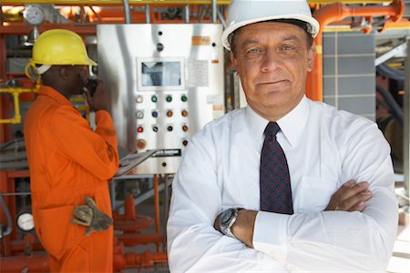 engineer on phone - Workers at Water Treatment Plant Stock Photo - Premium Royalty-Free, Code: 600-01582045