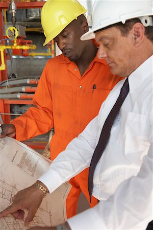 factory, african american - Workers Looking at Document Together Stock Photo - Premium Royalty-Free, Code: 600-01582049